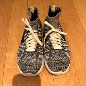 Woman’s Nike high top sock knit size 7 black,grey and white